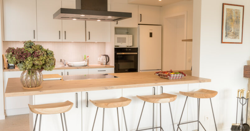 Fully-equipped kitchen, opening onto the lounge and dining room